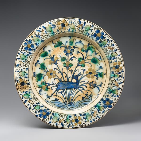 Dish · 16th century · Stonepaste; underglaze painted in black, blue, and green with red slip